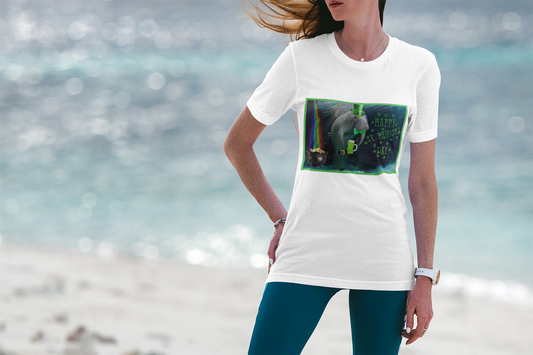 Happy St Patrick's Day Manatee Tee, model wearing white t-shirt on beach