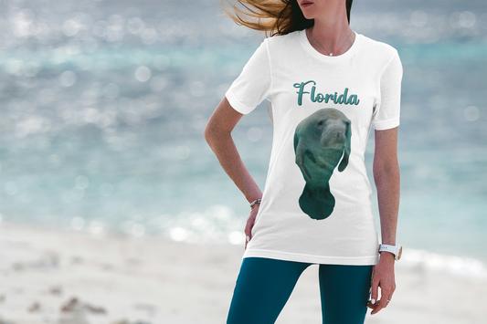 Magnificent Manatee Tee, model wearing white t-shirt on beach