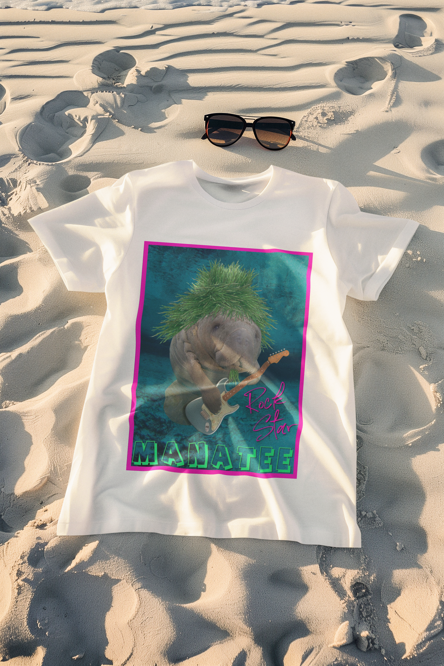 Rock Star Manatee Tee, white t-shirt on beach with sunglasses