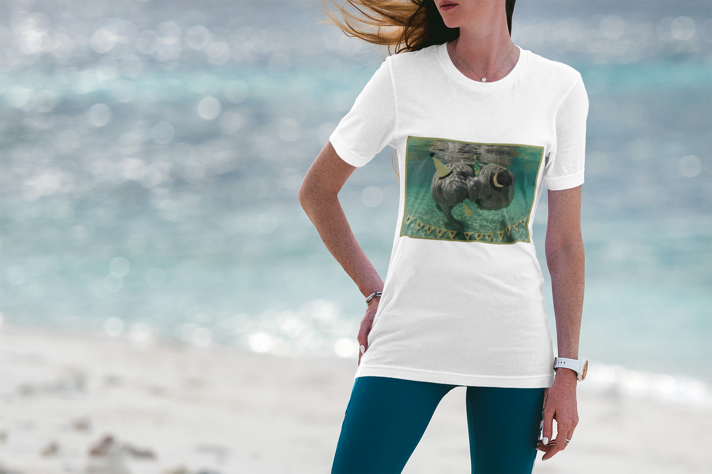 Happy New Years Manatee Tee, model wearing white t-shirt on beach