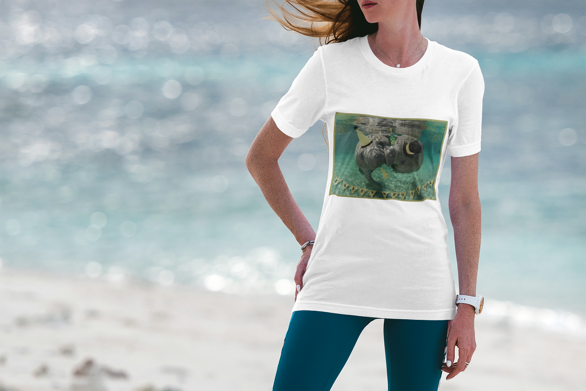Happy New Years Manatee Tee, model wearing white t-shirt on beach