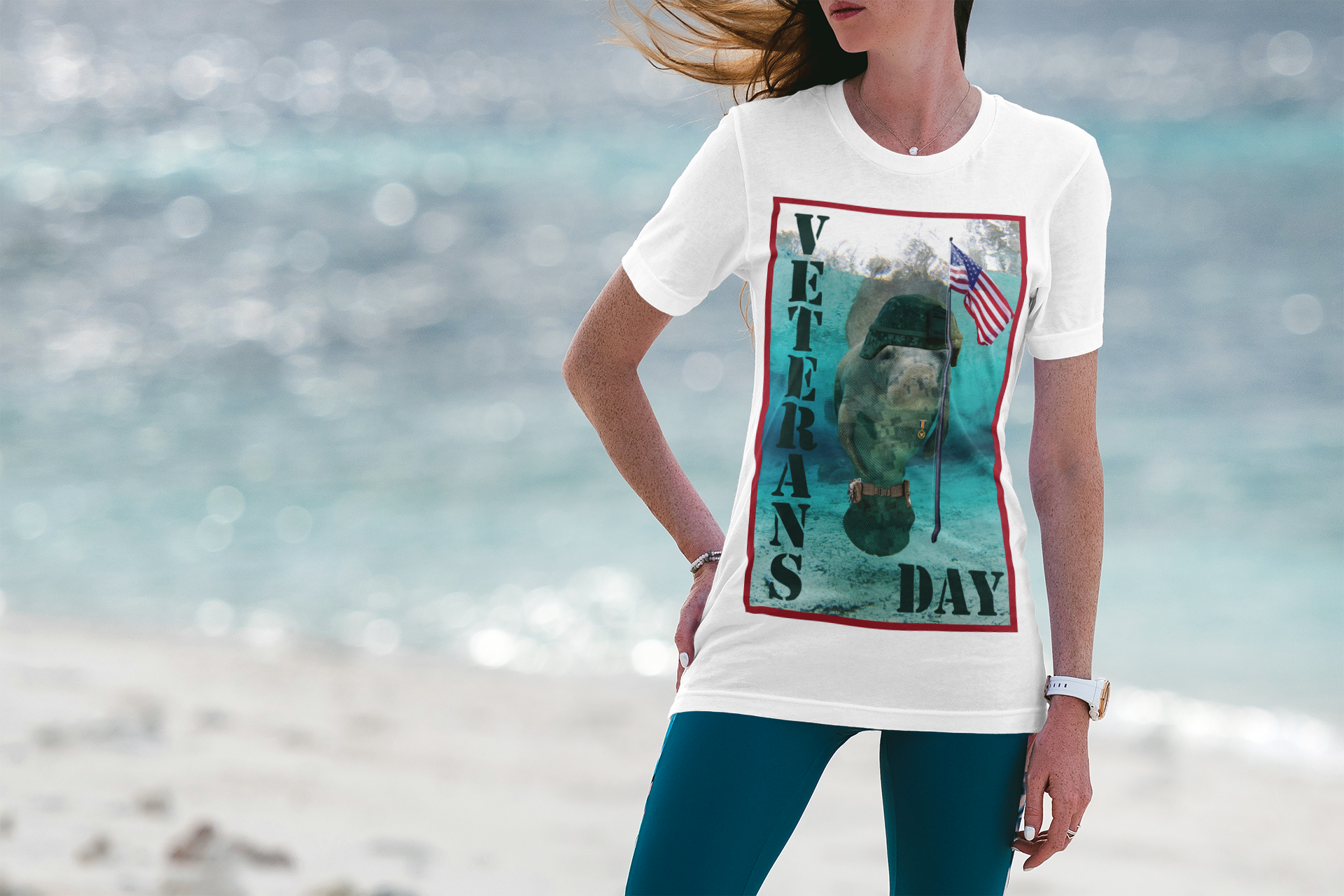 Veteran's Day Manatee Tee, model wearing white t-shirt on beach