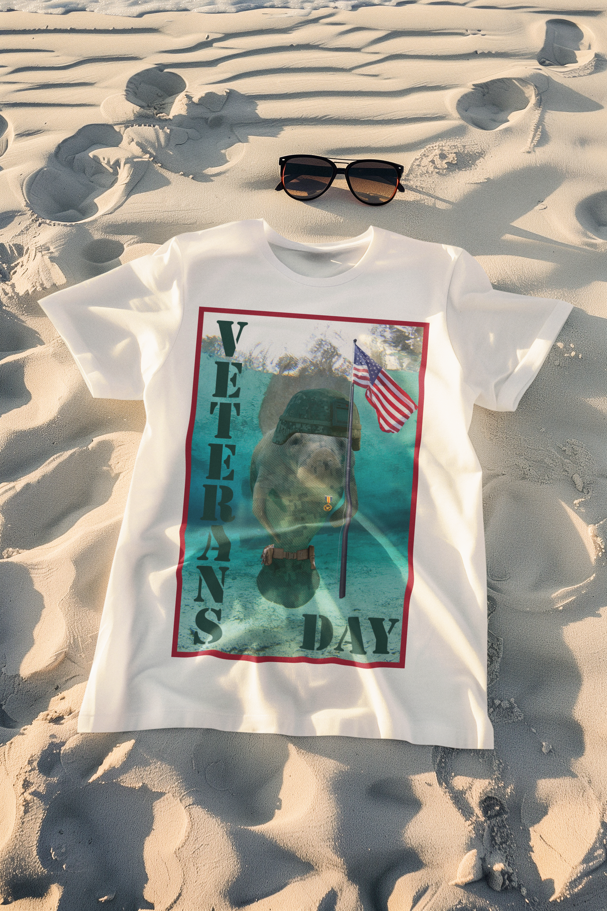 Veteran's Day Manatee Tee, white t-shirt on beach with sunglasses
