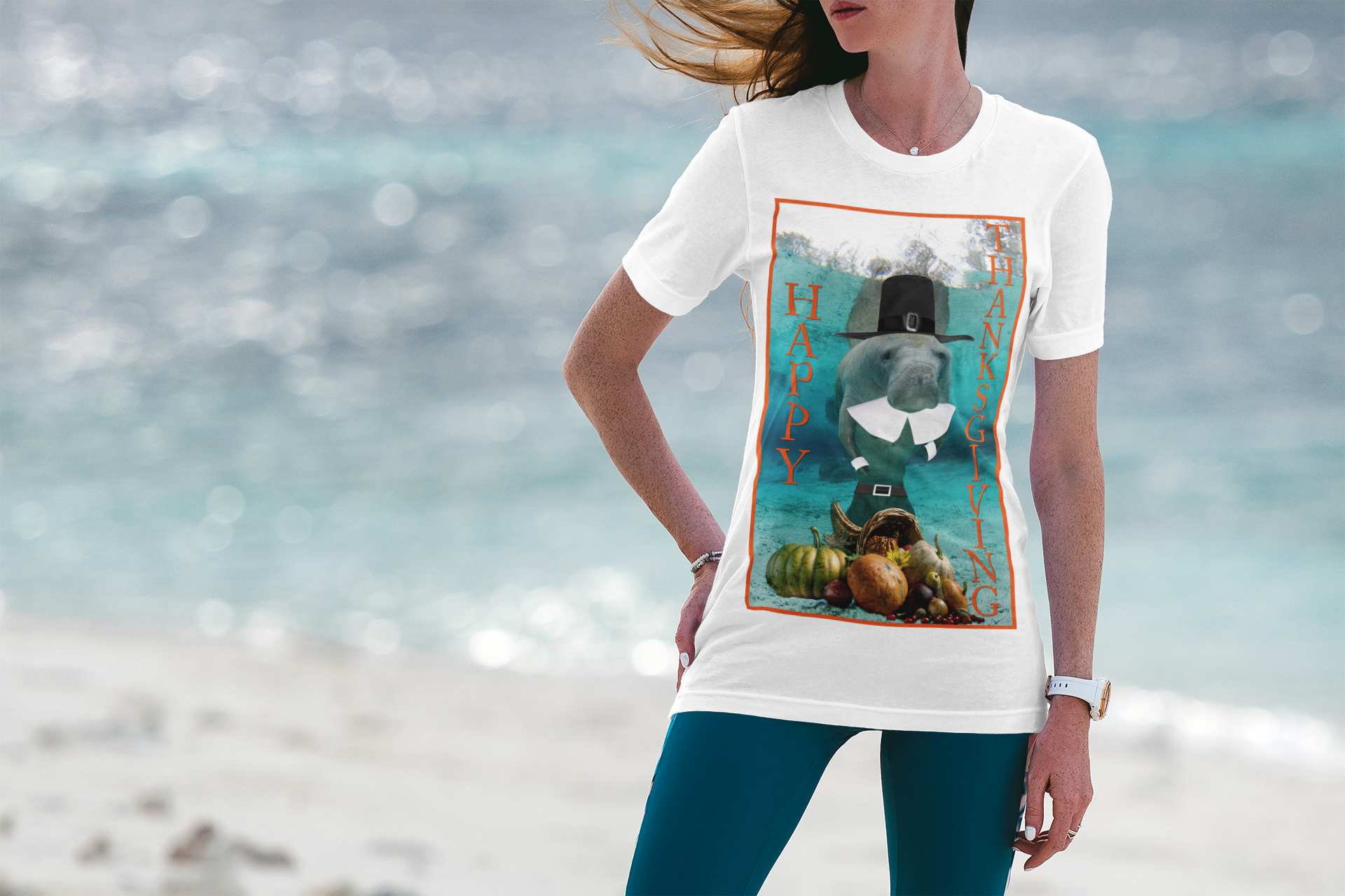 Happy Thanksgiving Manatee Tee, model wearing white t-shirt on beach