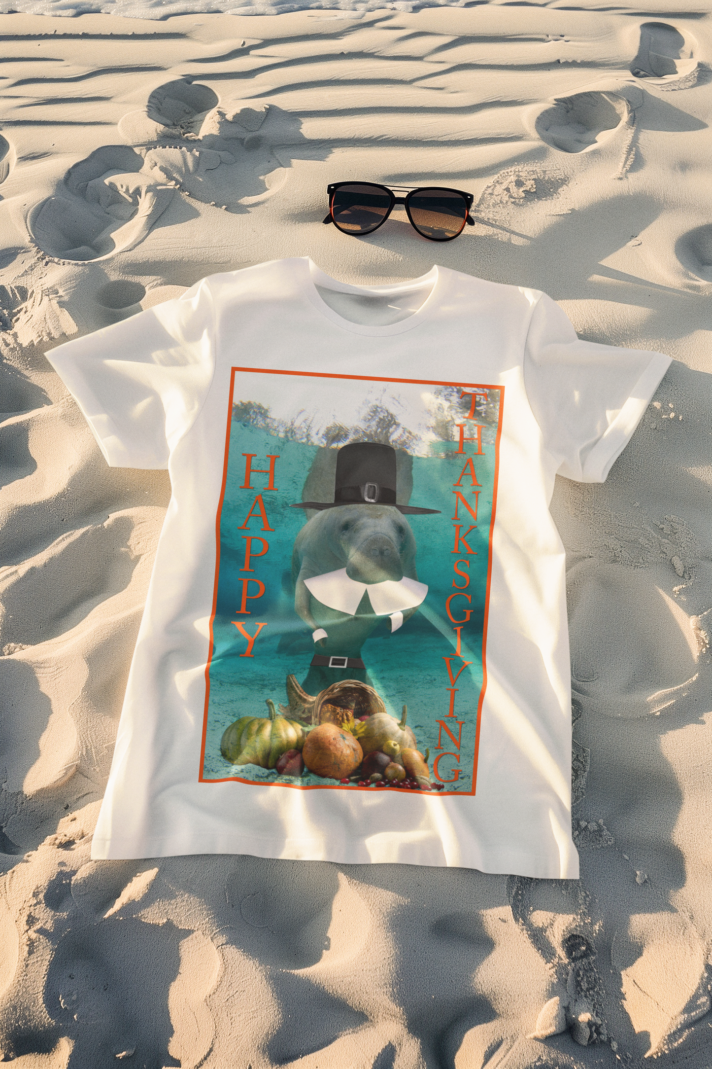 Happy Thanksgiving Manatee Tee, white t-shirt on beach with sunglasses