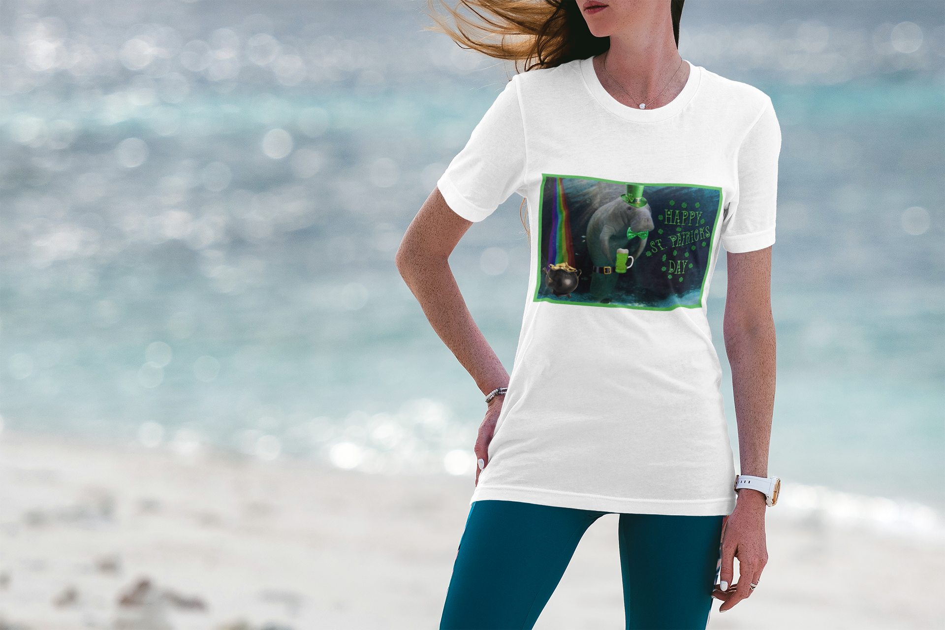 Happy St Patrick's Day Manatee Tee, model wearing white t-shirt on beach