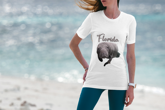 Manatee and Little Fish Tee, model wearing white t-shirt on beach